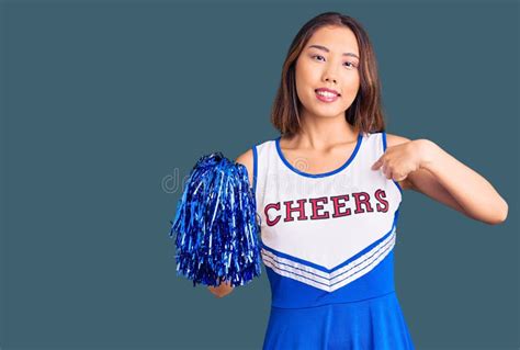 Young Beautiful Chinese Girl Wearing Cheerleader Uniform Holding Pompom