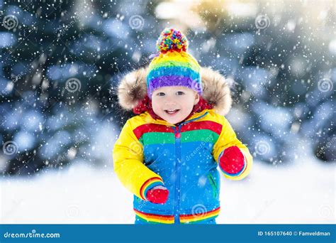 Child Playing With Snow In Winter Kids Outdoors Stock Photo Image Of