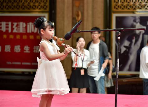 girl blowing cucurbit flute picture and hd photos free download on lovepik