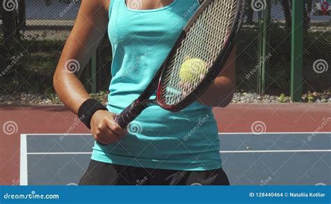 Woman Preparing To Hit The Tennis Ball With A Racket Stock Photo