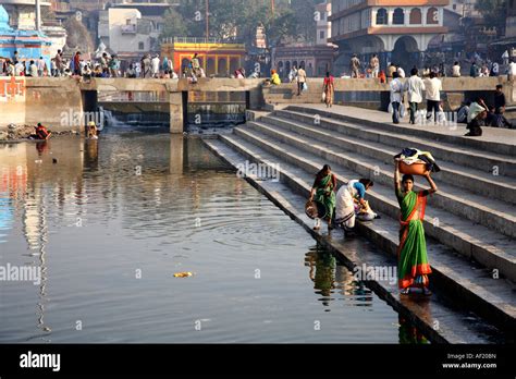 Indian Women Washing Clothing On The Steps Of Ramkund Bathing Tank Nasik Maharashtra India