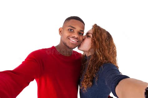 Happy Mixed Race Couple Taking A Selfie Photo Over A White Background