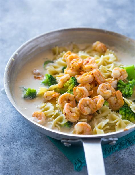 Next, the remaining butter, water, cream cheese, and parmesan cheese are added to the pan. Skinny Garlic Shrimp & Broccoli Alfredo | Gimme Delicious