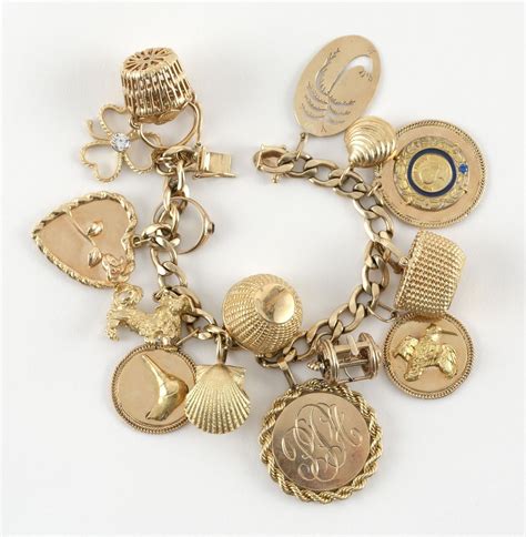 Sold Price 14kt Gold Charm Bracelet With Fourteen Charms Most Charms