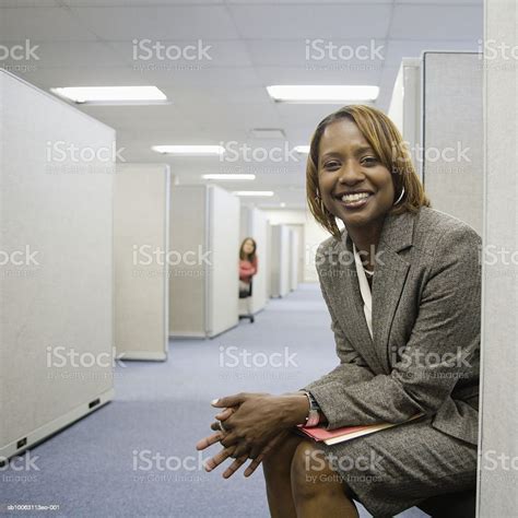 Two Businesswoman In Cubicle Smiling Stock Photo Download Image Now