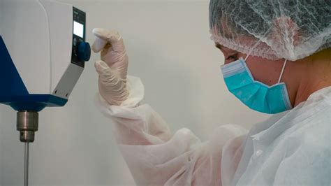 Chemist Adjust Pharmaceutical Equipment In Laboratory Stock Video