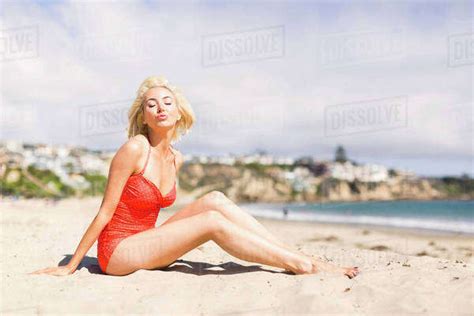 Portrait Of Blond Woman On Beach Stock Photo Dissolve