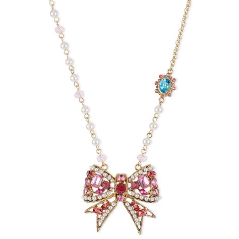Betsey Johnson Antique Gold Tone Crystal Bow Pendant Necklace In Gold