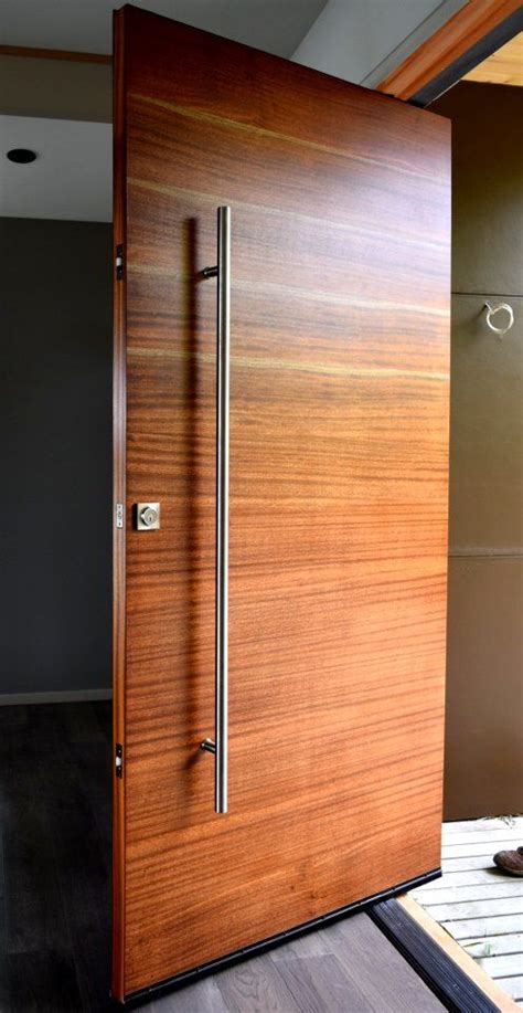 A Modern Wooden Door In The Middle Of A Room