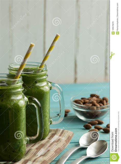 Two Green Smoothies In Mason Jar Mugs With Straws On A Table Wit Stock Image Image Of Healthy