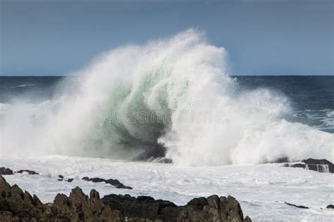 Wave Crashing Onto Rock Causing A Big Splash Stock Image Image Of
