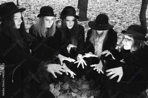 Coven Of Witches A Group Of Friends As Witches On Halloween Perform A