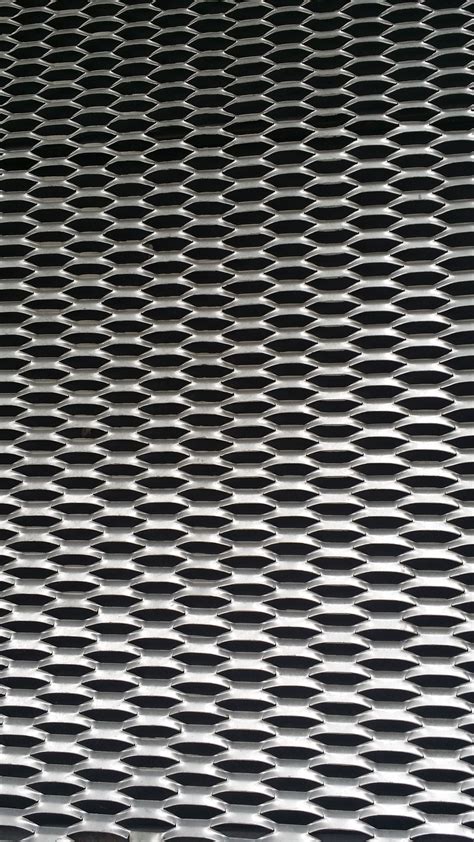 A Close Up View Of A Metal Grate