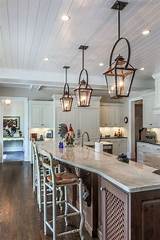 Our new kitchen pendants draw your eye into the island and make a bold statement. Copper lanterns with black bails over 15-foot island ...