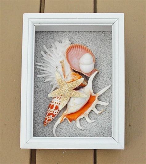 Maybe you would like to learn more about one of these? BEACH DECOR seashell collage shadow box, orange and white, natural shells, white frame, nautical ...