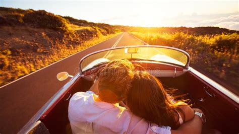 Romantic Couple Driving On Beautiful Road At Sunset Stock Photo Image