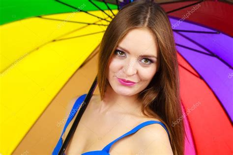 Woman Standing Under Colorful Rainbow Umbrella Stock Photo Voyagerix