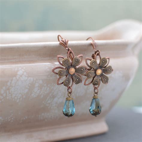 Antiqued Brass Flower Earrings With Blue Glass Teardrop Beads Etsy