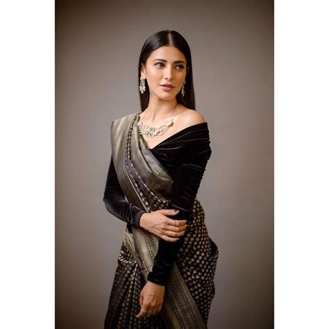 In A Black Color Saree And Velvet Off Shoulder Full Sleeve Blouse Design Exclusive Saree