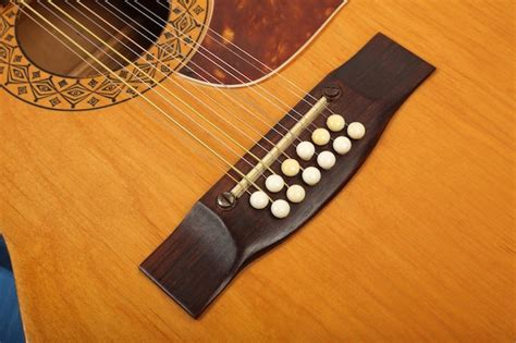 Premium Photo Musical Instrument Bridge And Pins Twelvestring