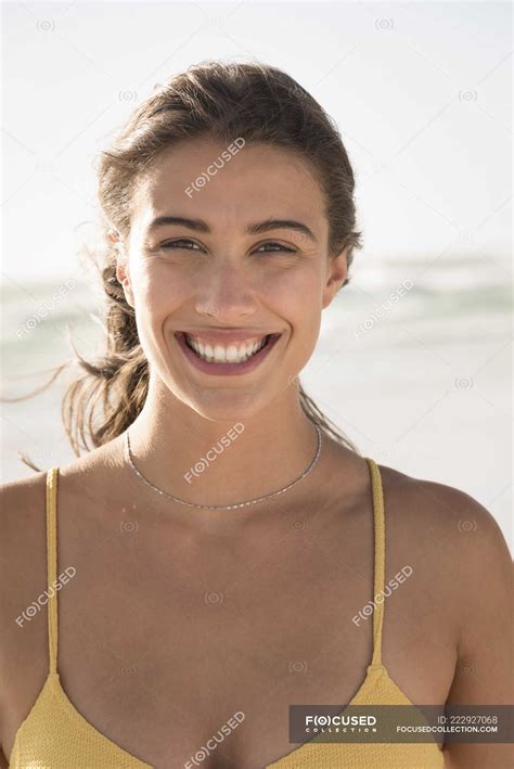 Smiling Young Woman Looking At Camera On Beach — Outdoors Brown Hair