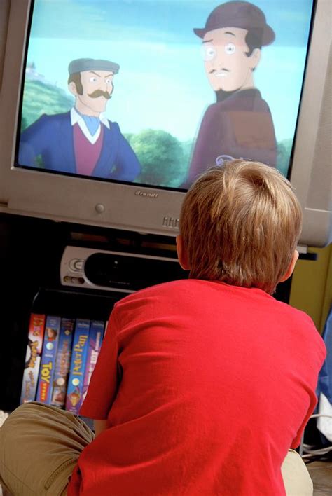 Boy Watching Television Photograph by Aj Photo/science Photo Library