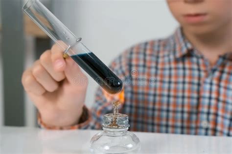 Teen Boy Heats Test Tube Burning On Alcohol Lamp Chemistry Experiment