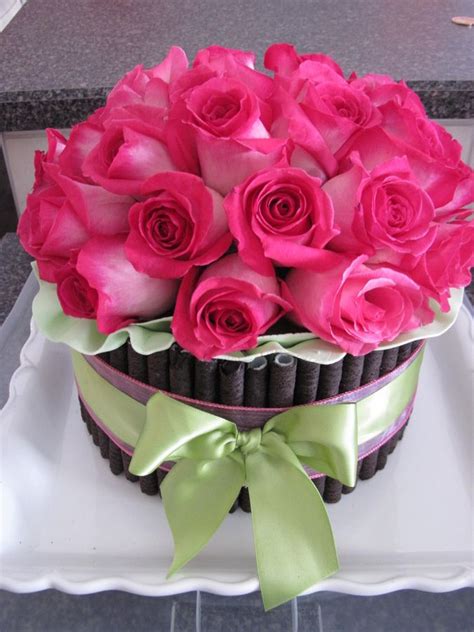 3 tier 18th birthday cake with pink roses, a large pink bow, black flowers with diamante centres, butterflies and lace. Fresh Flower cake — Birthday Cakes | Arreglos florales ...