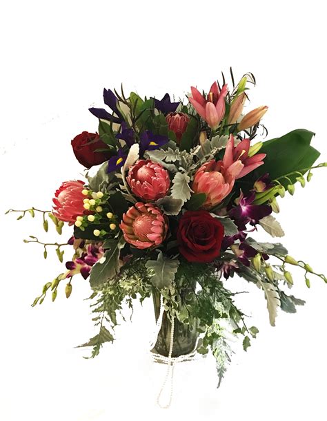 To please our customers and to continue to create and innovate with nature's bounty. Bouquet with proteas by Zaras Gifts & Flowers