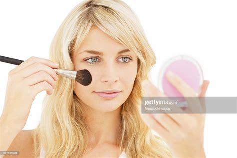 Young Woman Applying Blusher High Res Stock Photo Getty Images
