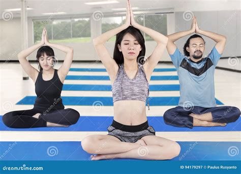 Female Instructor Practicing Yoga With Her Clients Stock Image Image Of Concentration Loss