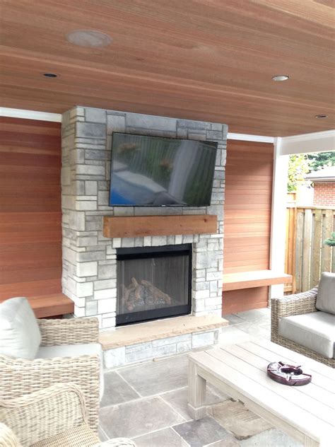 Poolside Cabanapool House With Fireplace And Feature Wall Using Kayu