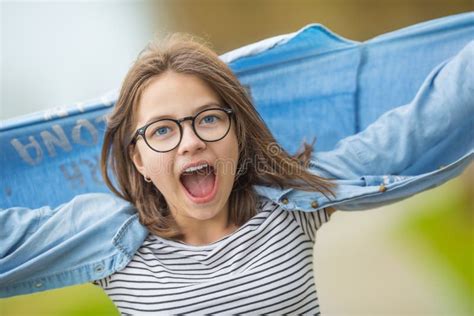 Portrait Of Crazy Happy Smilling Teenage Young Girl With Glasses Stock