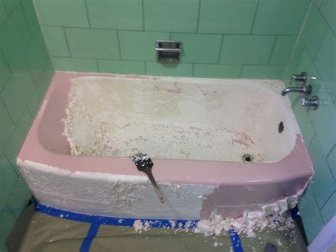 An expert starts by sanding down the tub's surface. How It Works