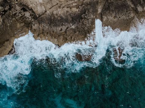 Free Photo Overhead Aerial Shot Of The Beautiful Ocean Cliffs And The