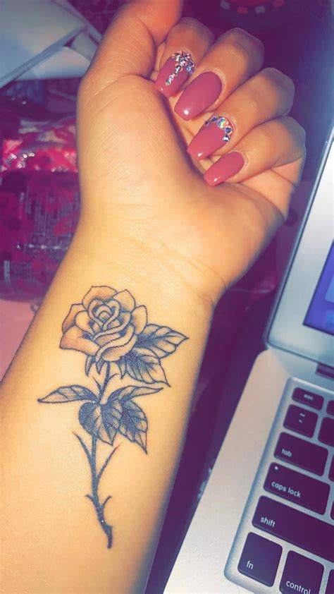 rose wrist tattoo tattooideasmeaningful sleevetattoos rose tattoos on wrist flower wrist