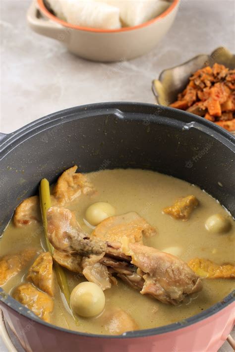 Premium Photo Cooking Opor Ayam Indonesian Chicken Curry With Tofu