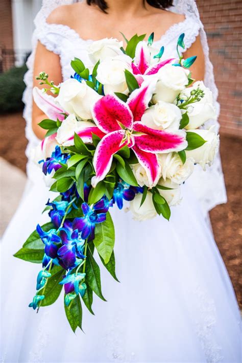 However, it can make a bouquet stand out, even against similar hues of bridesmaid dresses, since it's once you have a few ideas for your wedding bouquet, meet with a florist to make sure your choices are in your wedding flower budget. Bouquet with Pink Stargazer Lilies, White Roses, and Blue ...