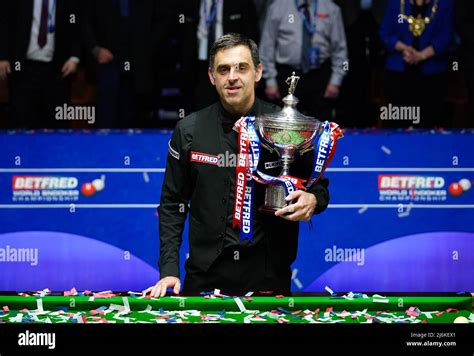 Ronnie Osullivan Celebrates With The Trophy During Day Seventeen Of The Betfred World Snooker