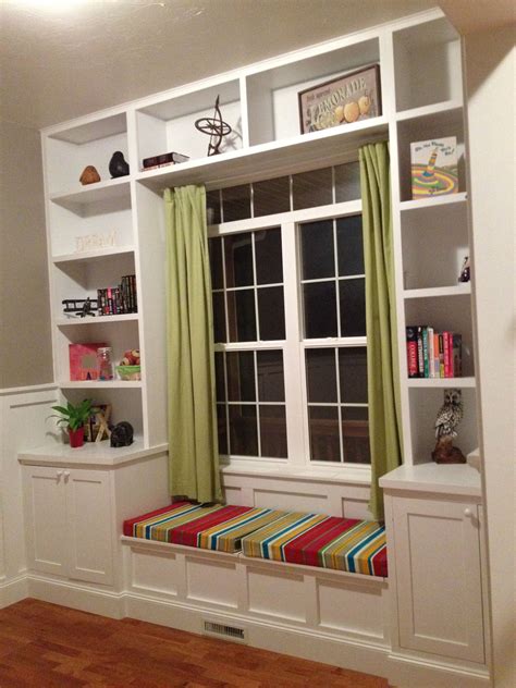 Built in bookshelves around the window with a seat for daydreaming. i