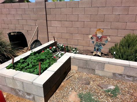 The bed frame can be as simple as 2 x 4s on top of the ground, or even patio retaining wall blocks. Above Ground Garden | Above ground garden, Cinder block ...