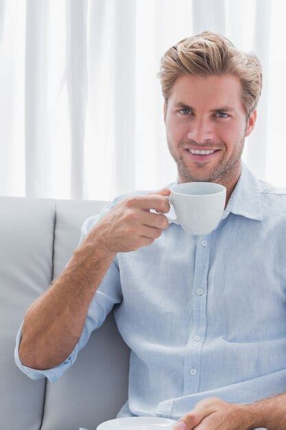 Premium Photo Cheerful Man Drinking A Coffee