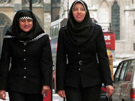 Two Metropolitan Police Officers Wearing Hijab Headdresses On Patrol In Central London The
