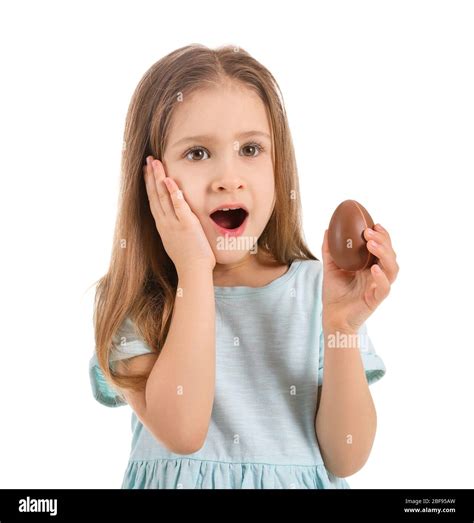 Surprised Little Girl With Sweet Chocolate Egg On White Background