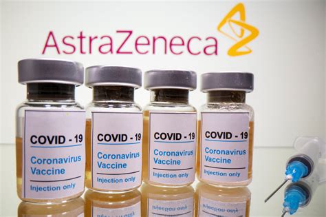 A health technician prepares a vial of the astrazeneca vaccine. Australia begins production of Oxford-developed COVID-19 ...