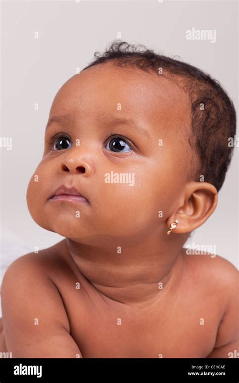 Adorable Little African American Baby Girl Looking Up Stock Photo Alamy