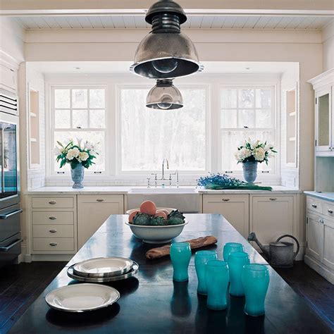 It is illuminated by a fancy chandelier that hung. Turquoise Kitchen Accents - Cottage - kitchen - Wick Design