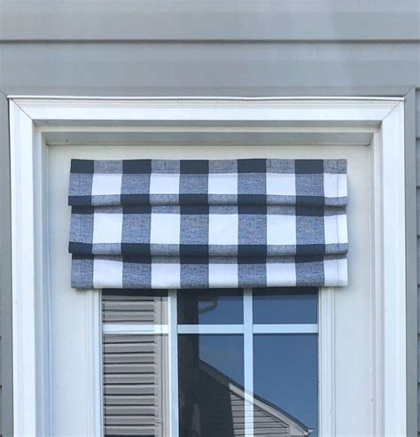 A Window With A Black And White Checkered Valance