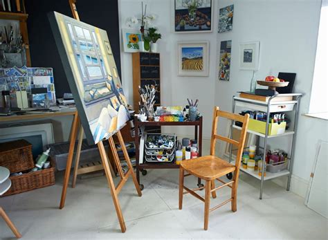 An Artists Studio With Easel Canvass And Other Art Supplies In It
