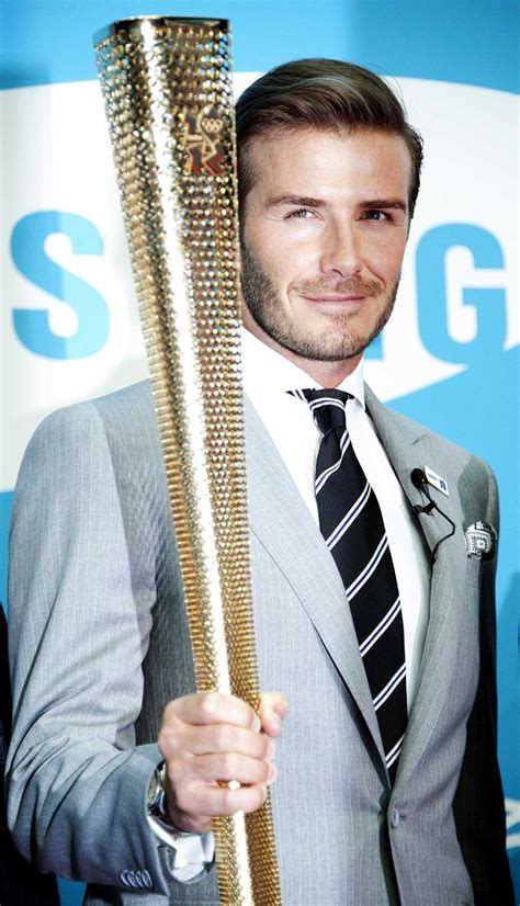 David Beckham Carries The Torch Of Style For The Olympics Can We Say